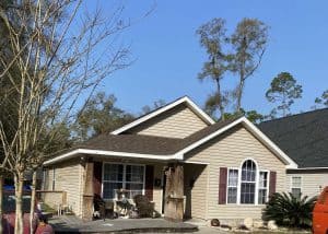 Roof replacement with new shingles on a residential home in Monticello, FL. Expert roofing crew inst.