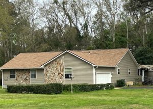 Roof replacement with new shingles on a residential home in Tallahassee, FL.