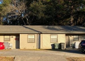 Roof repair crew working on a residential building in Tallahassee, FL.