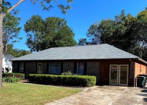 Roof replacement crew working on a residential home in Tallahassee, FL.