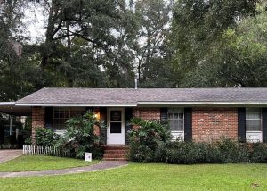 Roofers installing new roof on a residential home in Tallahassee, FL.