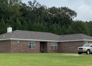 Roofers installing new roof on a residential home in Crawfordville, FL.