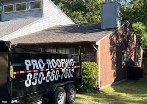 Roofers installing new roof on residential home in Monticello, Florida.
