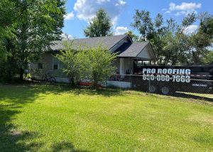 Roofers installing new roof on residential home in Crawfordville, FL.