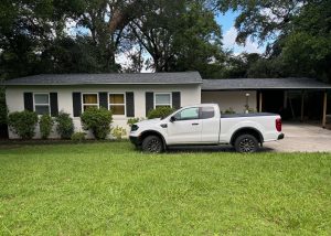 Storm damage inspection on residential roof in Crawfordville Florida.