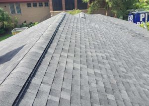 Roof replacement with new asphalt shingles on residential home in Tallahassee, FL.
