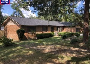 Roof replacement project in Tallahassee, FL, showcasing a residential home with a new asphalt shingl.
