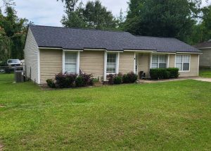 Roof replacement with new asphalt shingles on a single-story residential home in Tallahassee, FL.