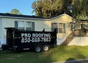 Roofers installing new roof on residential home in Monticello, Florida.