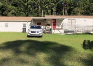 Residential roof replacement with new shingles on a single-story home in Tallahassee.