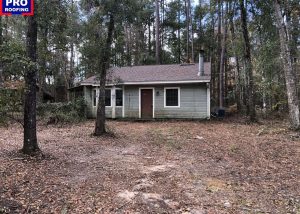 Residential home with new roof installation in Crawfordville, FL, after storm damage repair.